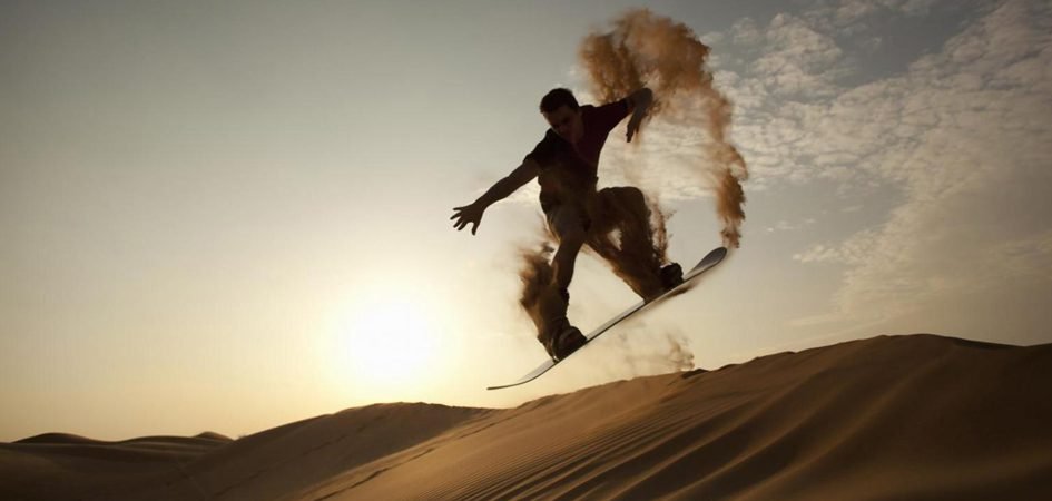 Sandboarding Speeding Down the Dunes in Dubai