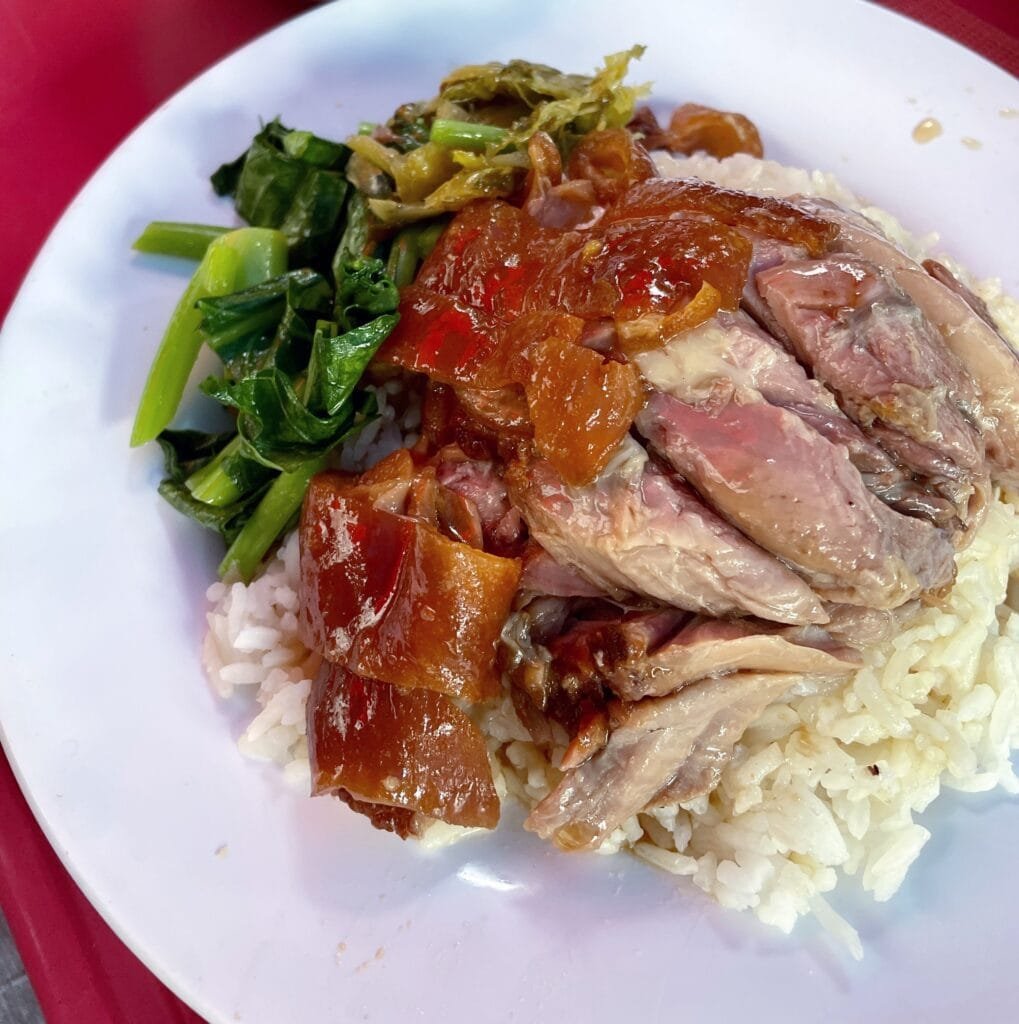 Braised pork leg served on rice with pickled mustard greens and boiled egg.