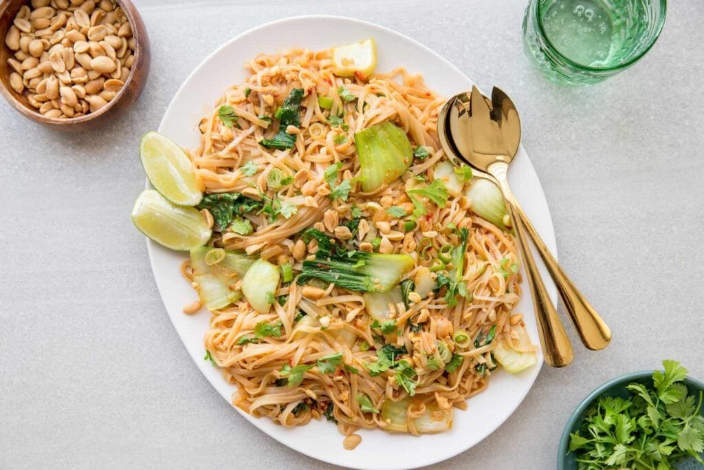 Vegetarian Pad Thai served with tofu, peanuts, and lime.